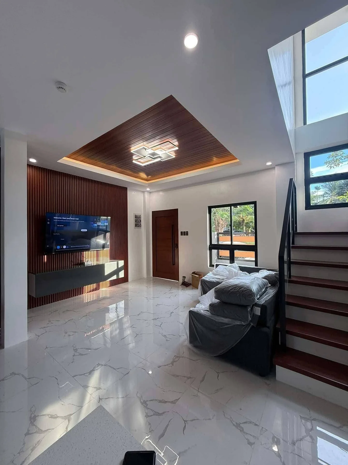 Modern living room interior construction by JMG Construction in Cagayan de Oro